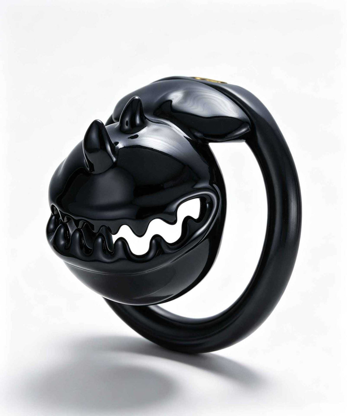 Black Monster Mouth resin chastity cage from a front angle