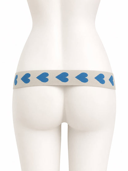 Blue hearts support strap shown from the rear on a display mannequin