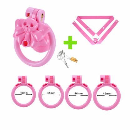 Pink skull chastity cage with pink three-way belt and four rings