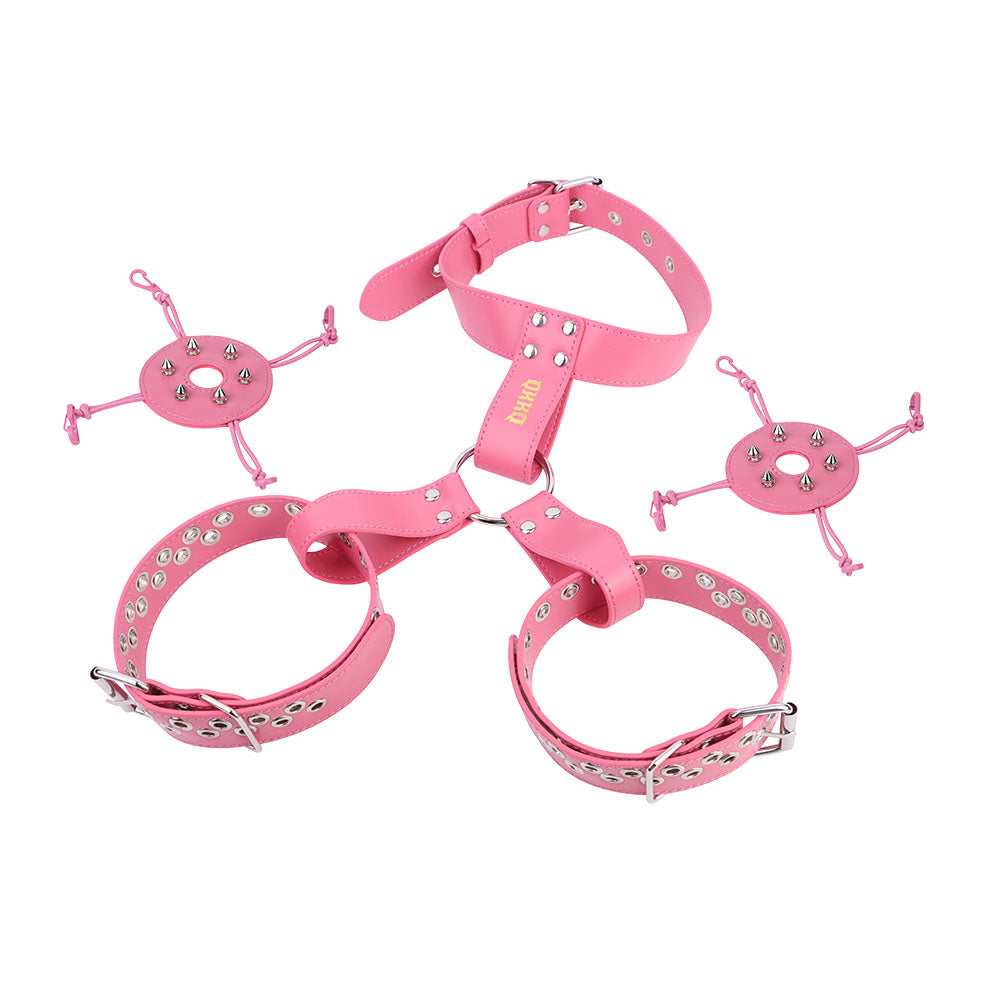 Pink harness with detachable covers laid out beside the breast bands