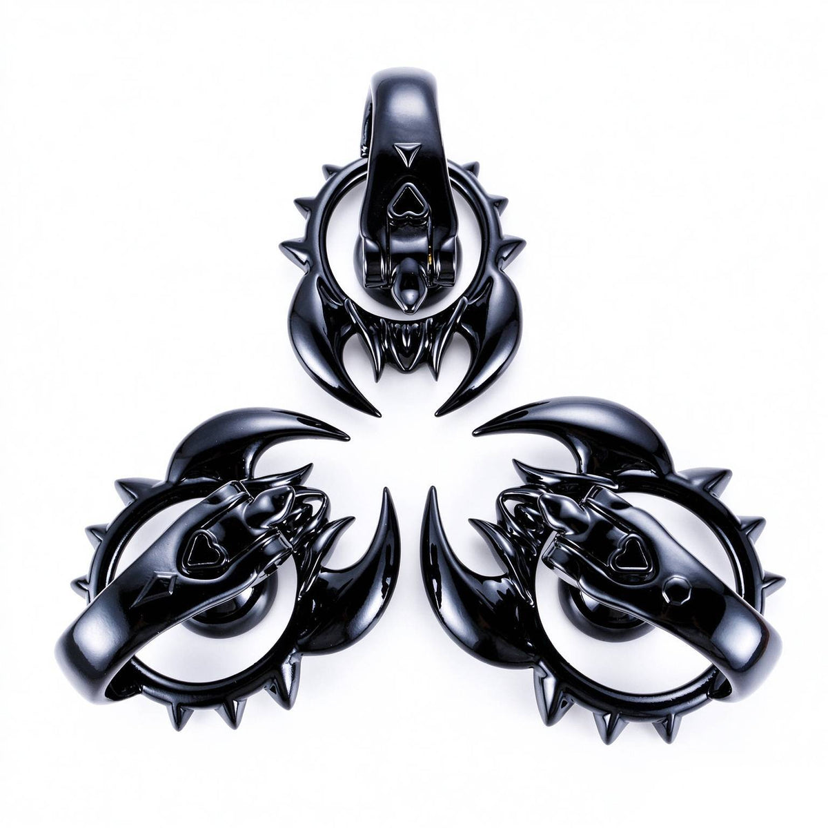 Black scorpion chastity cage front and side angles on white background